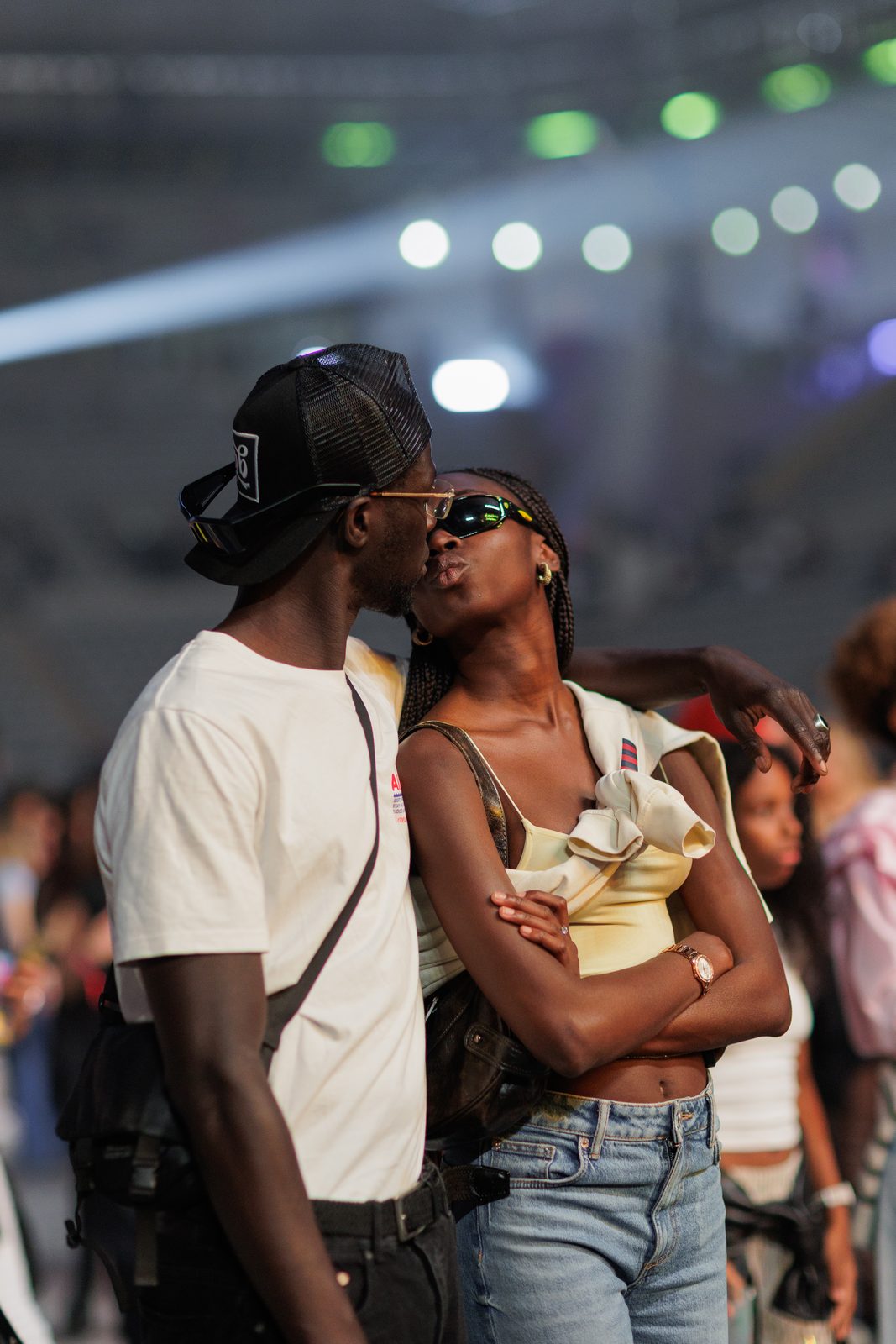 A couple caught in the moment under the arena lights