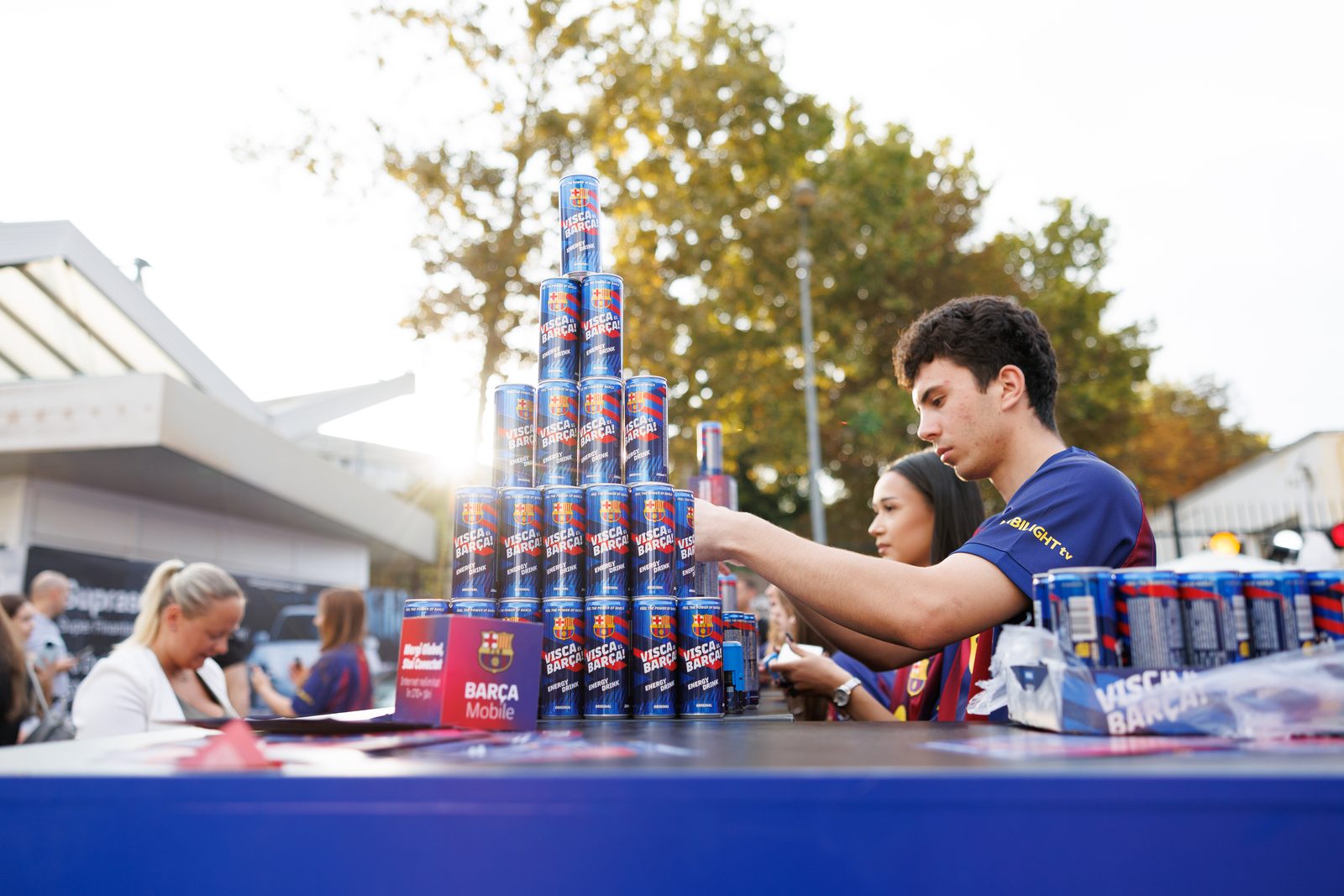 Building a can pyramid at an open-air activation